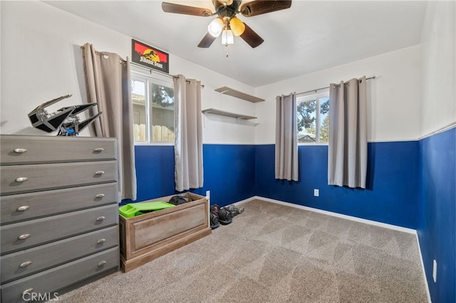 bedroom with ceiling fan and carpet