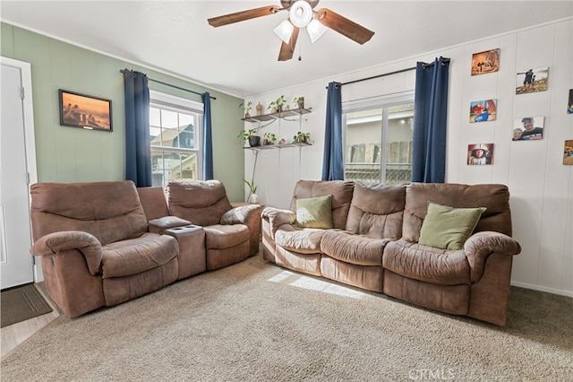 living room featuring carpet flooring and ceiling fan