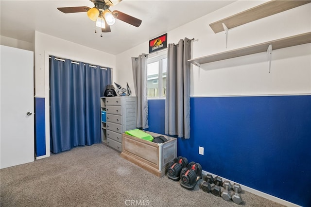 interior space with carpet flooring and ceiling fan