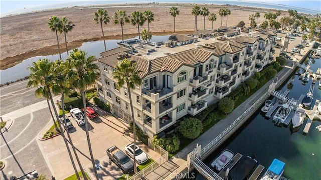 birds eye view of property with a water view