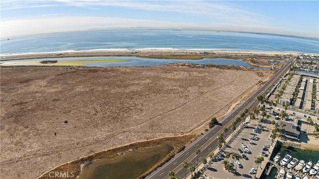 bird's eye view featuring a water view and a view of the beach