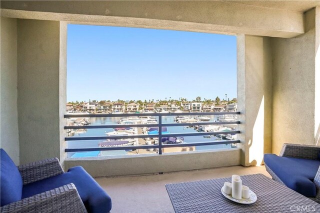 balcony featuring a water view