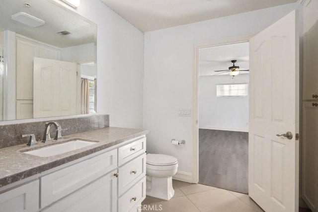 bathroom featuring vanity, ceiling fan, tile patterned floors, and toilet