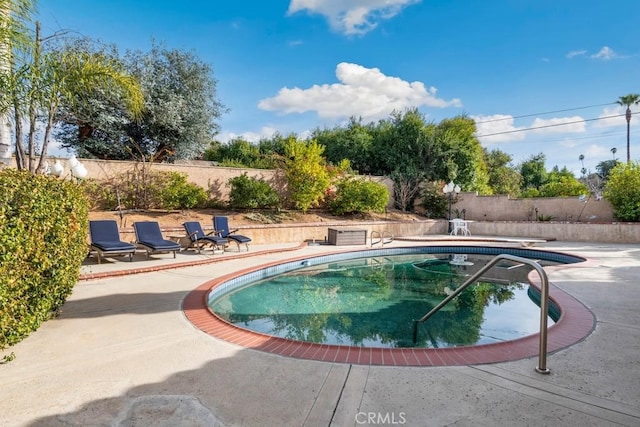 view of swimming pool featuring a patio area