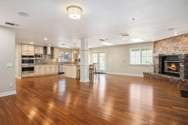 unfurnished living room with hardwood / wood-style floors