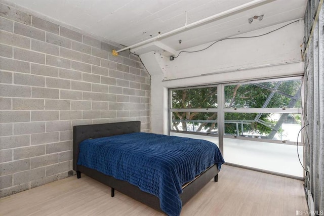 bedroom with wood-type flooring