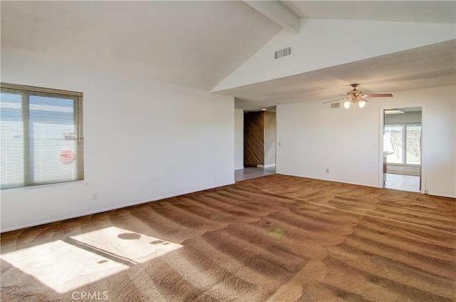 carpeted spare room with ceiling fan and lofted ceiling with beams