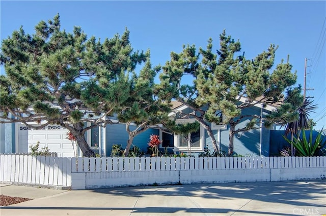 view of property hidden behind natural elements