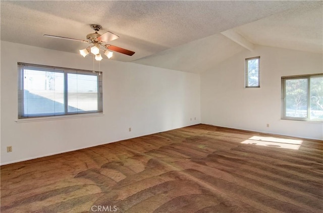 bonus room with a wealth of natural light, carpet flooring, a textured ceiling, and lofted ceiling with beams