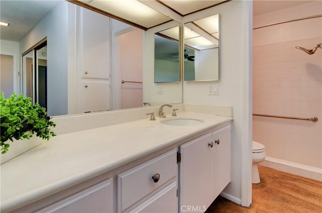 bathroom featuring toilet and vanity