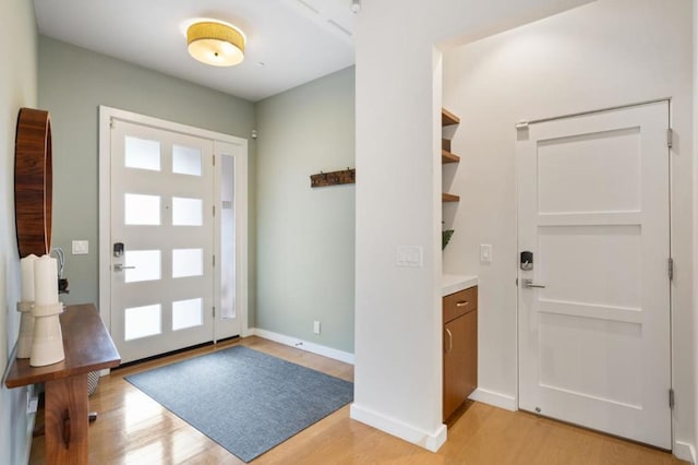 entrance foyer with light wood-type flooring