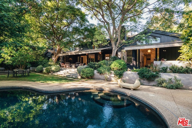 view of pool featuring a patio