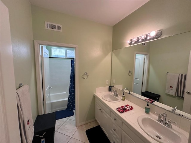 bathroom with tile patterned flooring, vanity, and shower / bath combination with curtain