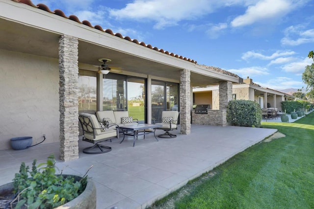 view of patio / terrace with outdoor lounge area, an outdoor kitchen, and grilling area