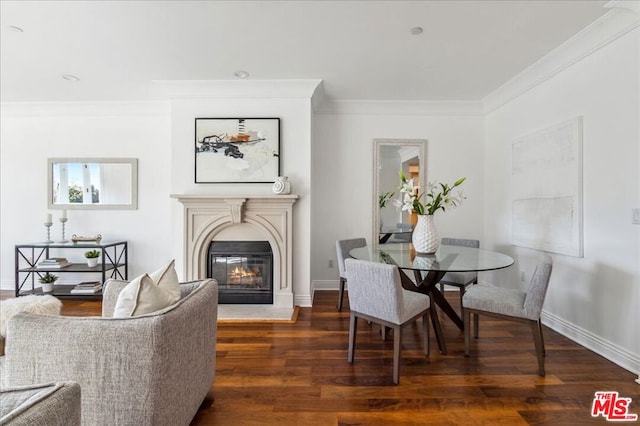 dining room featuring ornamental molding and dark wood-type flooring