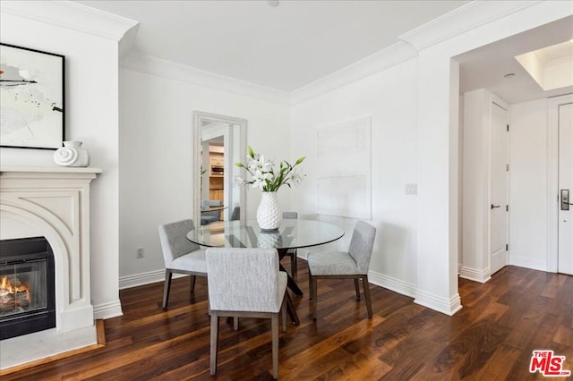 dining room featuring crown molding and dark hardwood / wood-style floors