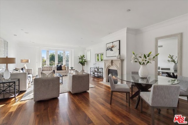 living room with ornamental molding and dark hardwood / wood-style floors