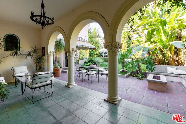 view of patio / terrace with a fire pit