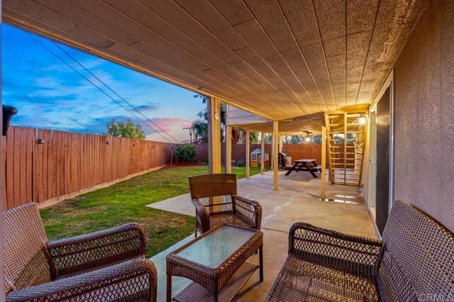 patio terrace at dusk with a yard