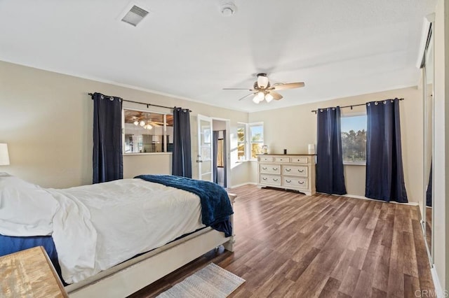 bedroom with ceiling fan and wood-type flooring