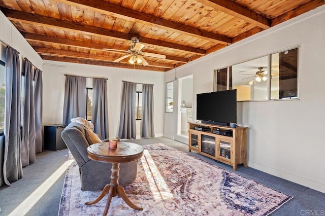 carpeted living room with wooden ceiling, plenty of natural light, and beam ceiling