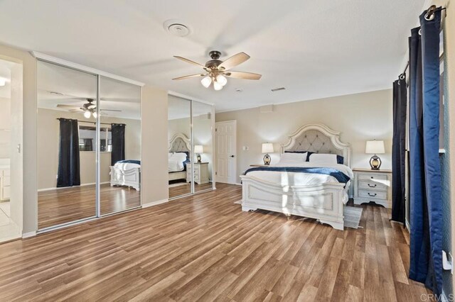 bedroom featuring hardwood / wood-style floors and ceiling fan