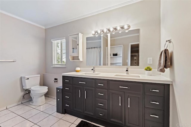 bathroom featuring vanity, toilet, crown molding, and tile patterned flooring