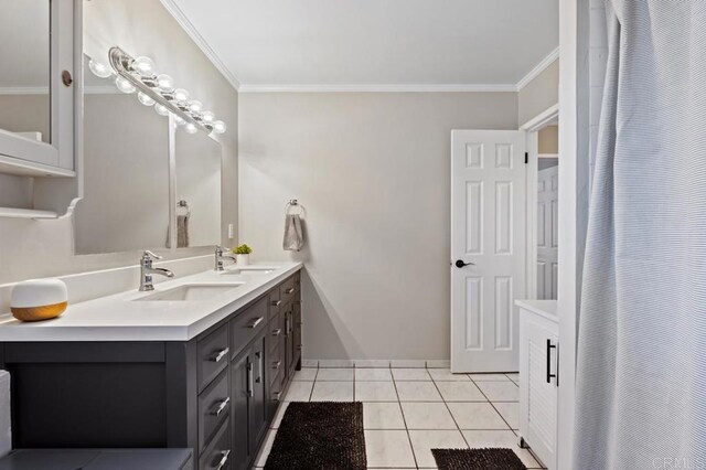 bathroom with vanity, ornamental molding, and tile patterned floors