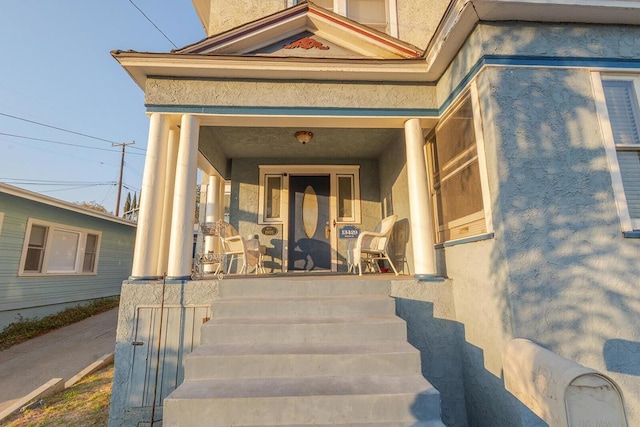 doorway to property with a porch