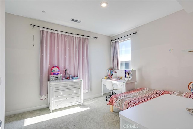 bedroom featuring light carpet