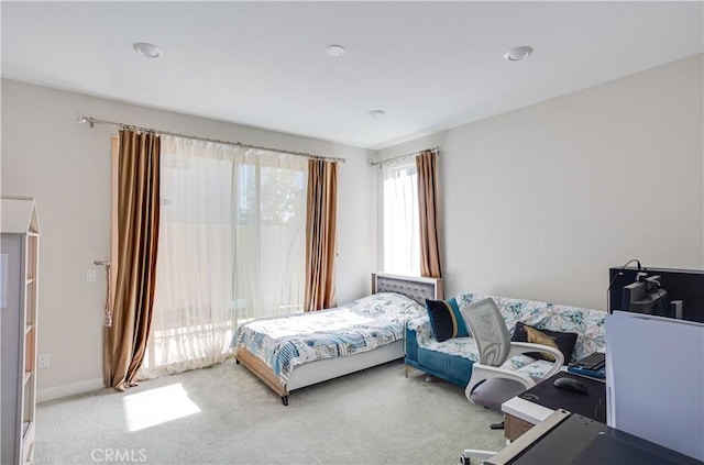 bedroom featuring light colored carpet