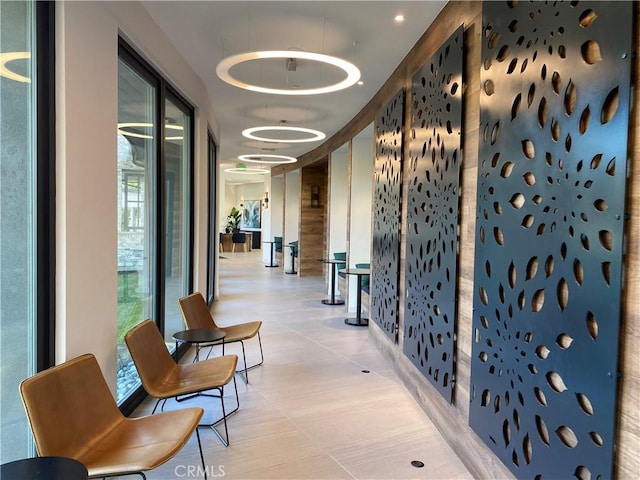 hall featuring light tile patterned floors