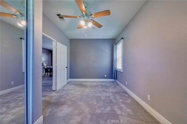 unfurnished bedroom featuring carpet and ceiling fan