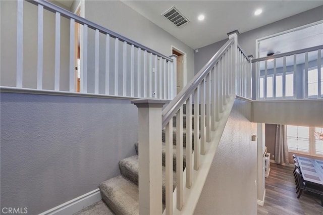 stairway featuring hardwood / wood-style flooring