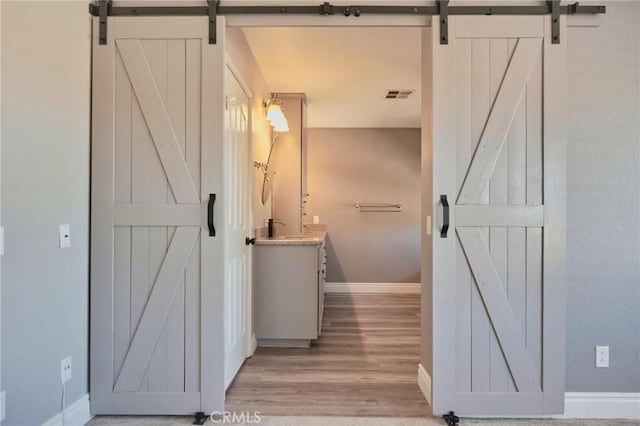 bathroom with wood-type flooring and vanity