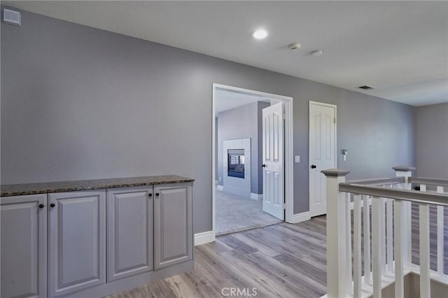 corridor featuring light hardwood / wood-style flooring