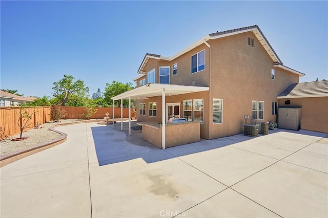 back of property featuring a patio area