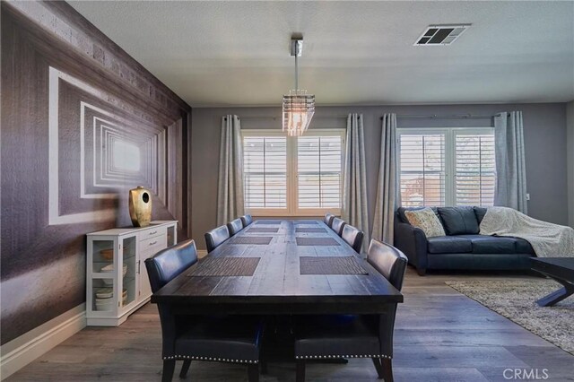 dining area featuring dark hardwood / wood-style flooring