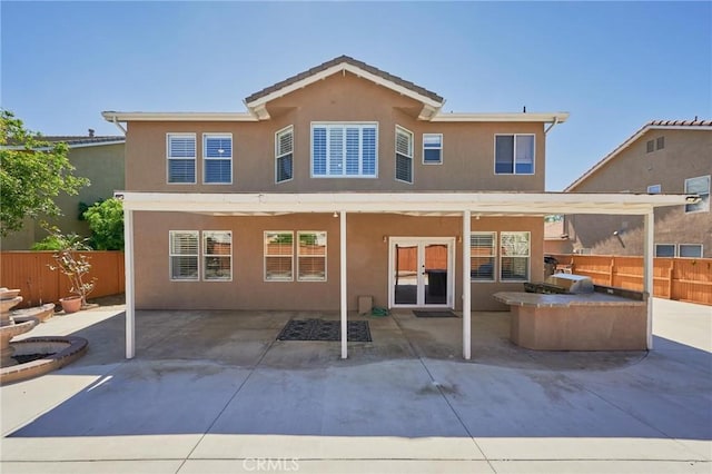 back of property with a patio area