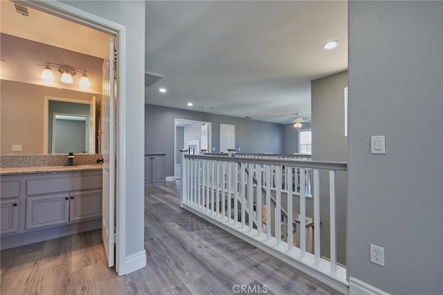 hall with light wood-type flooring