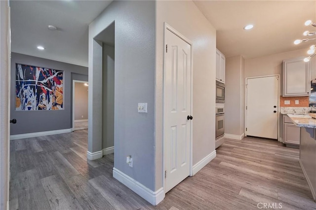 hallway featuring light hardwood / wood-style flooring