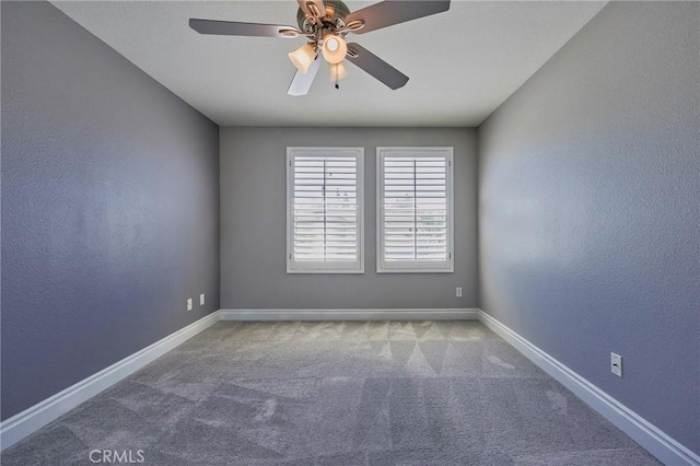 unfurnished room with carpet flooring and ceiling fan