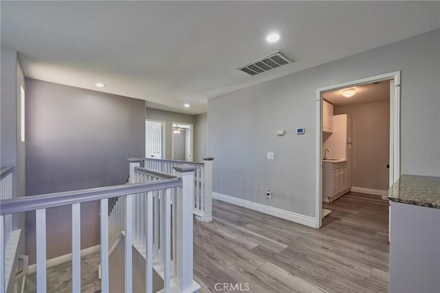 hallway featuring light hardwood / wood-style flooring