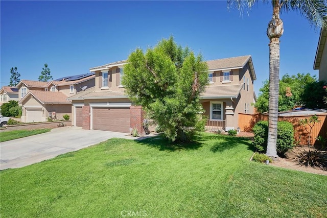 view of front of home with a garage and a front lawn