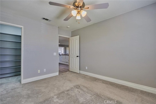 unfurnished bedroom featuring ceiling fan and light colored carpet