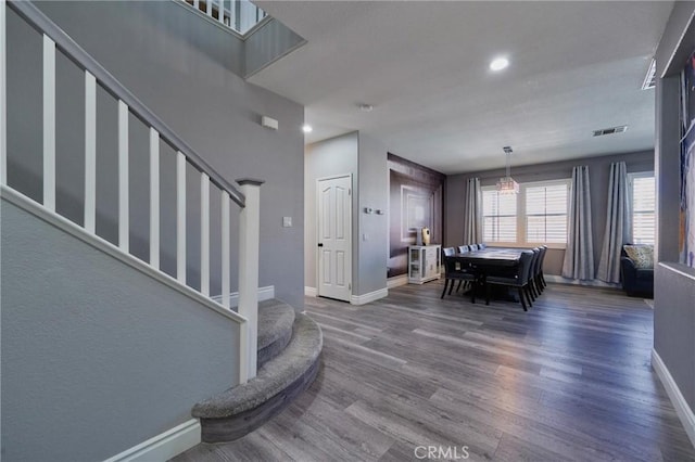 dining space with dark hardwood / wood-style floors