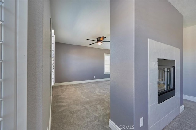 unfurnished living room with carpet floors and ceiling fan