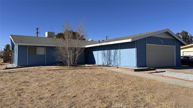 ranch-style home with a garage