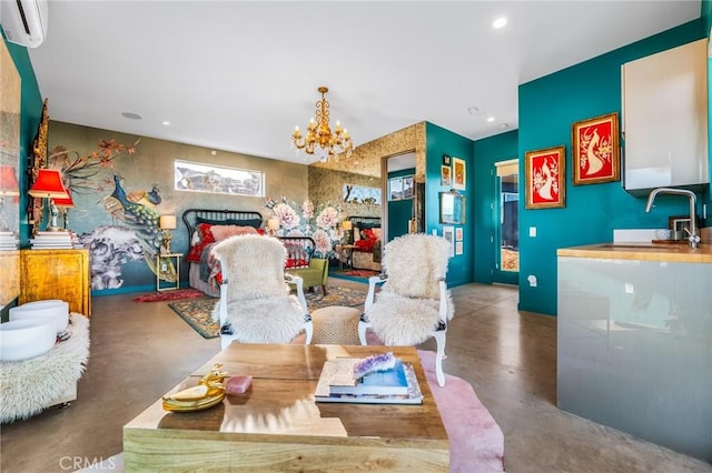 interior space with sink, a chandelier, a wall mounted AC, and concrete flooring