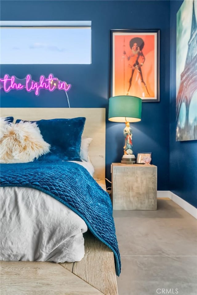 bedroom with concrete flooring